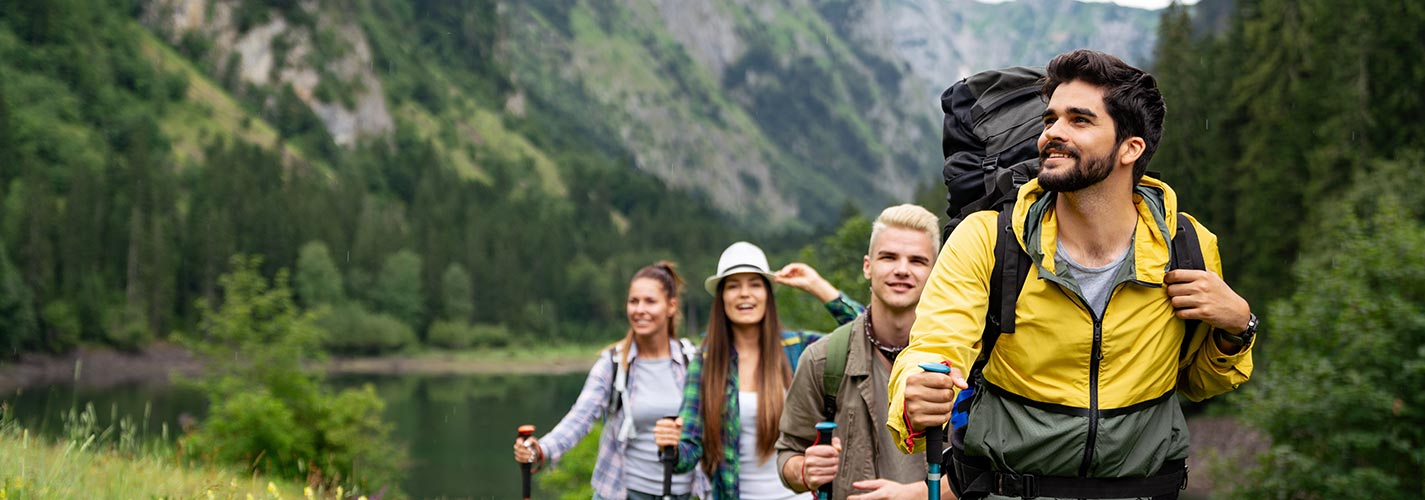 Four people on their first hike through the mountains.