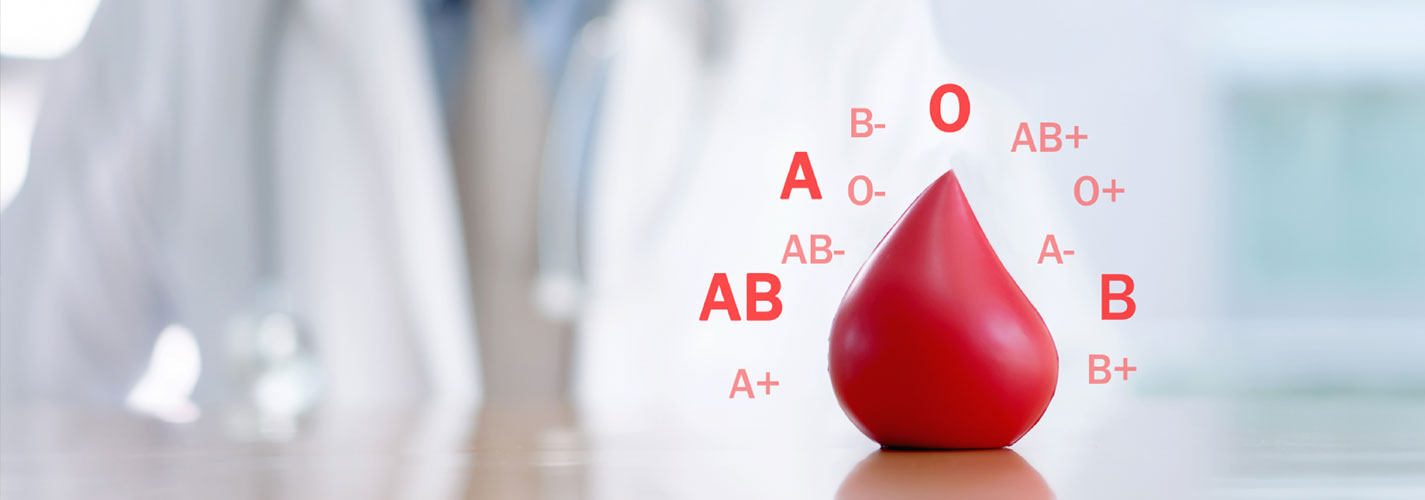 Blood donation concept of a drop of blood surrounded by blood types against a medical background.